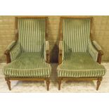 BERGERES, a pair, early 20th century French beechwood with cushion seats in striped green plush,