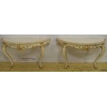 DEMI LUNE CONSOLE TABLES, a pair, Victorian style cream and gilt with cabriole legs,