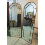 GARDEN MIRRORS, a pair, gilt metal framed, each with an arched top, 64cm W x 180cm H.