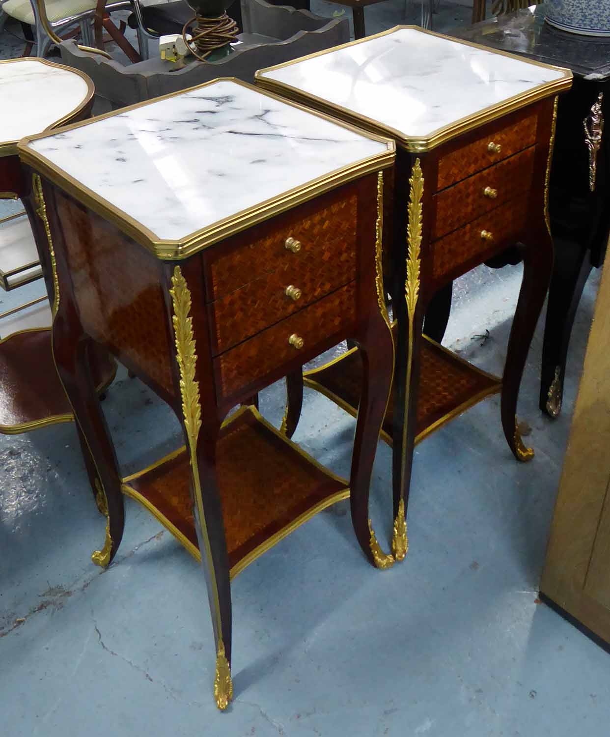 SIDE TABLES, a pair, square form with three drawers below Louis XV style with marble tops,