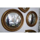 BUTLERS MIRRORS, a pair, in gilded frames, 54cm diam.