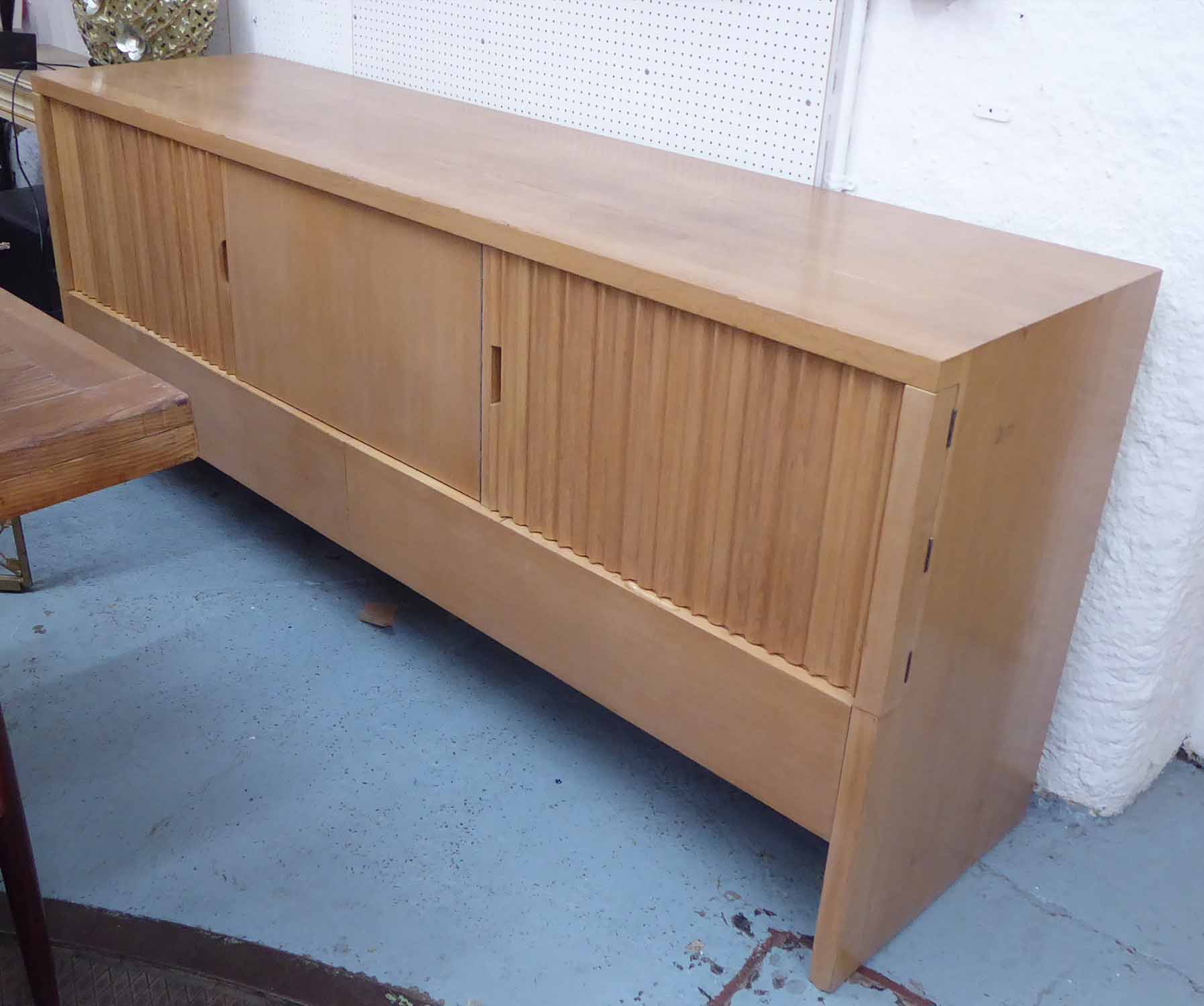 SIDEBOARD, in three sections with shelves and one with three drawers on end block supports,