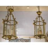 HALL LANTERNS, two, brass of cylindrical form with glass panels, one 61cm H x 32cm,