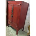 INDIA JANE WEDDING CABINET, Chinese red lacquer with two panelled doors and three short drawers,