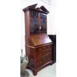 BUREAU BOOKCASE, George II mahogany of compact proportions,