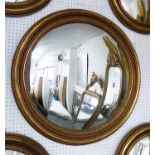 BUTLERS MIRROR, Regency style with gilded surround, 82cm diam.
