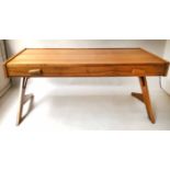 WRITING TABLE, 1970's walnut, rectangular with three frieze drawers and angled trestle supports,