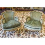 BERGERES, a pair, early 20th century Louis XV style painted with cushion seats in green plush,