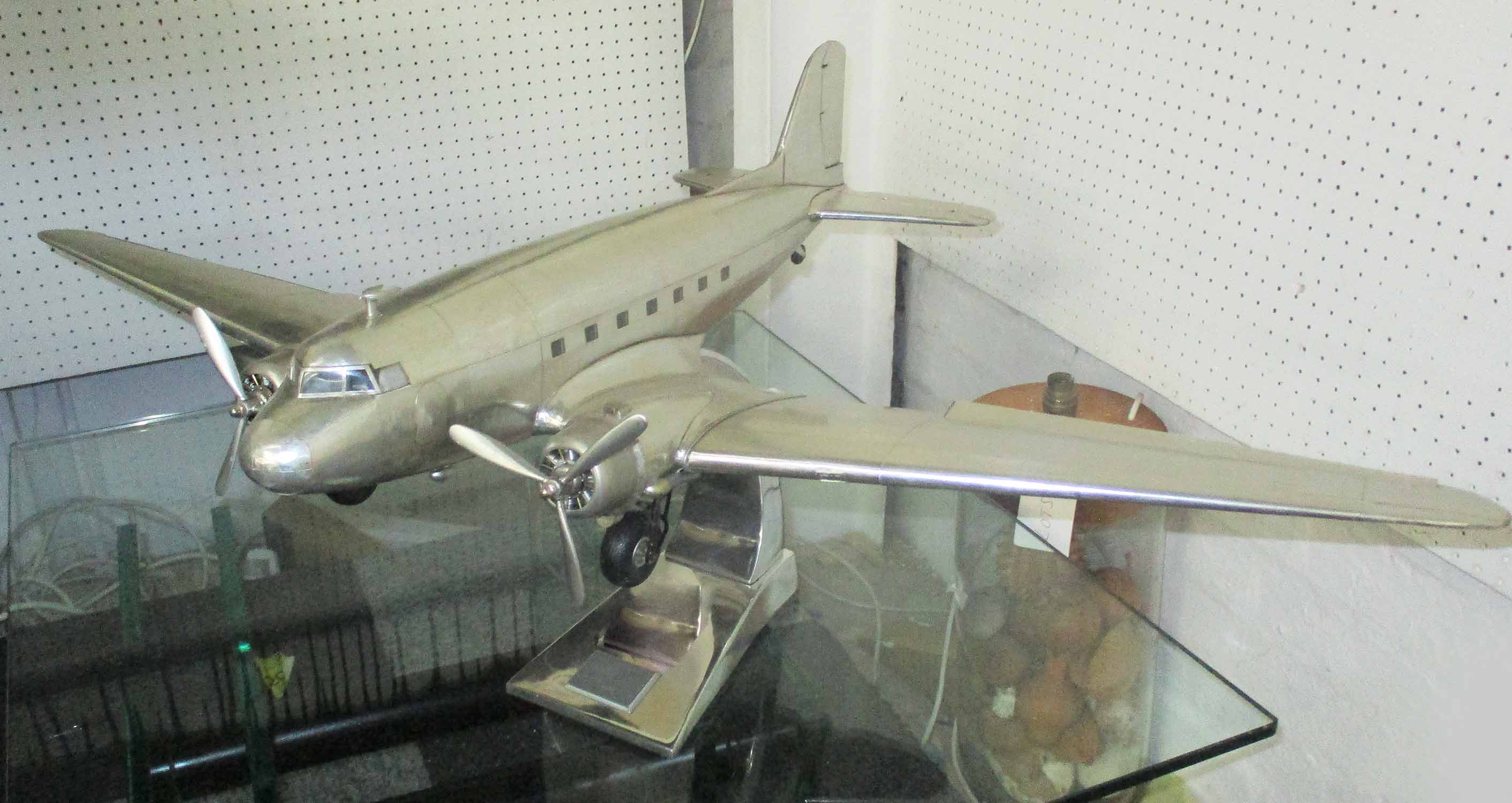 DC3 AIRCRAFT MODEL, in aluminium on stand, 98cm x 66cm x 38cm H.