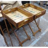 DRINKS TRAYS ON STANDS, a pair, stamped with various Champagne houses, 77cm H.