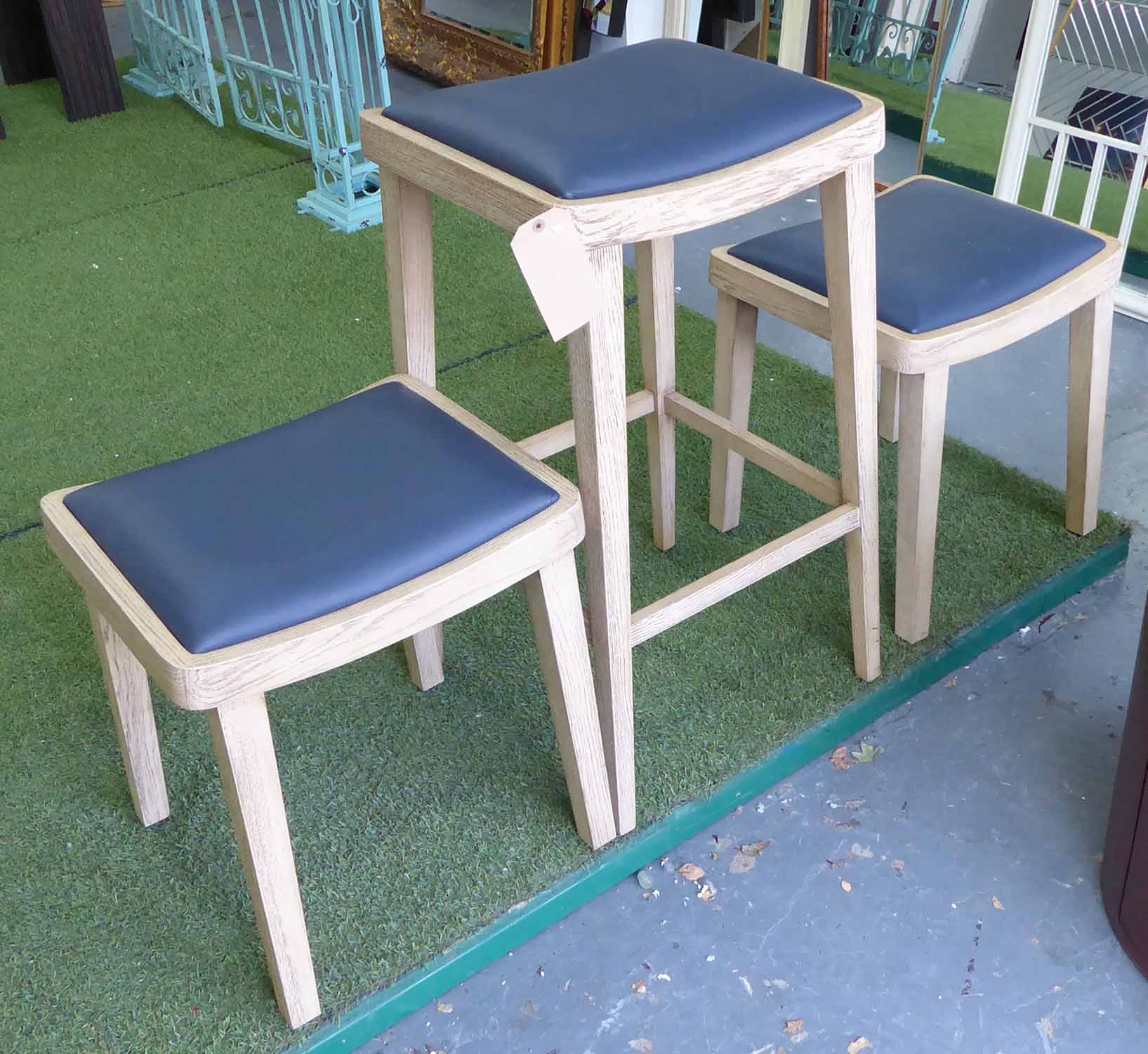 JUSTIN VAN BREDA HORSINGTON STOOLS, a set of three, tallest 85cm H.