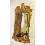 WALL MIRROR, early 20th century George II style giltwood with scroll, leaf,