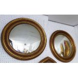BUTLERS MIRRORS, a pair, in gilded frames, 54cm diam.