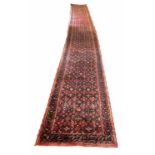 NORTH WEST PERSIAN LONG RUNNER, 687cm x 79cm, all over Herati design.