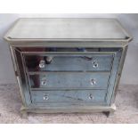 MIRRORED CHEST, with a bevelled glass top above three drawers with glass handles,