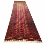 BOKHARA RUNNER, 530cm x 125cm, repeat tribal guls within multiple corresponding borders.