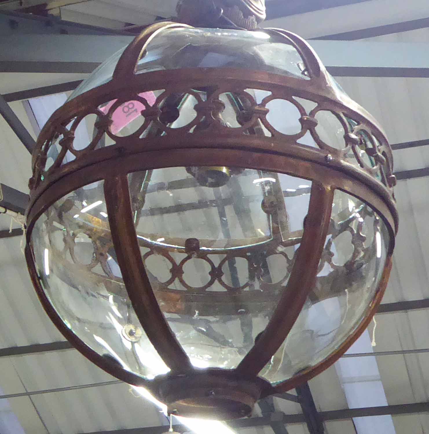 GLOBE CEILING LAMPS, in a bronzed finish, 69cm diam plus chain.