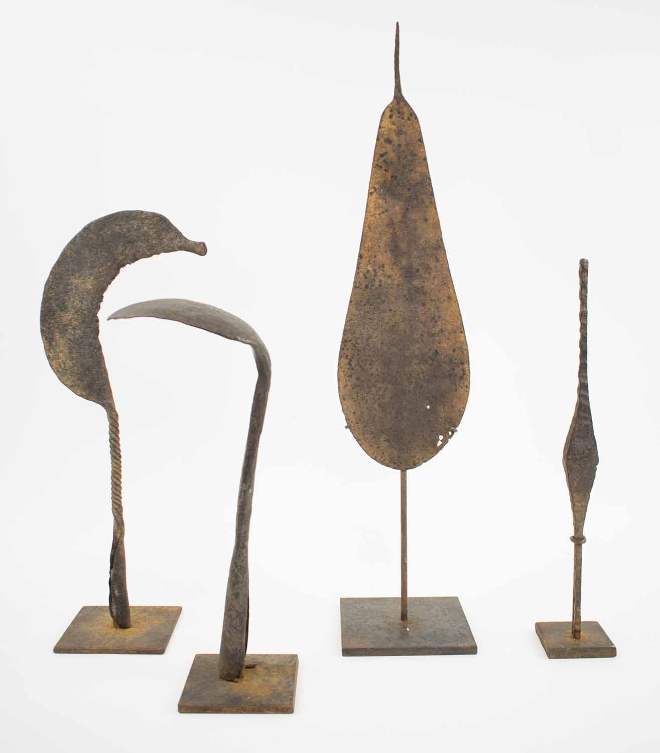 ANTIQUE WEST AFRICAN HOE CURRENCY, collection of four, in various shapes, hand forged iron,