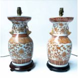 TABLE LAMPS, a pair, Chinese ceramic terracotta foliate design of open vase form with handles,