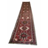 KARAJA RUNNER, 458cm x 80cm, row of geometric medallions within corresponding borders.