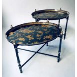 TRAY TABLES, a pair, oval toleware black and gilt with pierced gallery and folding support,