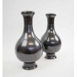 CHINESE BOTTLE VASES, a pair, mottled black glaze with impressed seal marks to base,