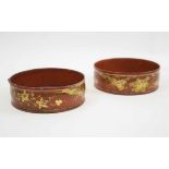 REGENCY WINE COASTERS, a pair, red papier mache with gilt decoration, 14cm Diam.