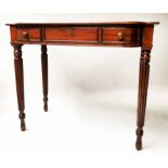 WRITING TABLE, George IV mahogany with three frieze drawers and reeded supports,