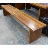 ATTRIBUTED TO ROUNDHOUSE BENCHES, a pair, oiled walnut finish, 220cm x 46cm x 38cm.