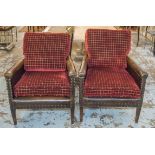 CLUB ARMCHAIRS, a pair, 1920's French leather with later red velvet upholstered seat cushions,