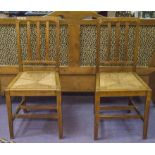 SIDE CHAIRS, a pair, early 20th century oak, Heals manner with rail backs and drop in rush seats.