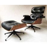 EAMES STYLE LOUNGER AND STOOL, black leather and bent wood framed revolving with companion stool,