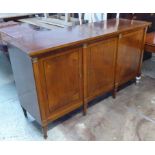 SIDEBOARD, Empire design mahogany with three fitted cupboard doors flanked by brass fitted columns,