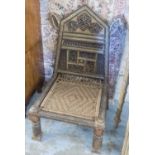 LOW CHAIRS, a pair, Afghanistani with brass and carved detail and woven string seats, 52cm x 99cm H.