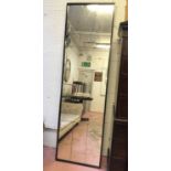 WALL MIRROR, 1940's black painted frame with sectional plates, 220cm H x 65cm.