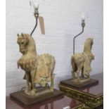 CHINESE LAMPS, a pair, in the form of terracotta horses, 77cm H.