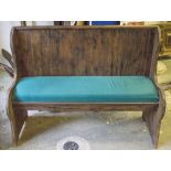 CHURCH PEW, plywood and stained pine, with green padded seat, 106cm H x 139cm W.