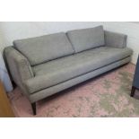 AARK SOFA, grey chenille finish on ebonised supports 91cm D x 215cm W x 84cm H (with faults).