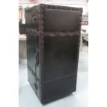 UPRIGHT BAR TRUNK, rectangular studded leather enclosing compartments and shelves on castors,
