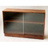 LOW BOOKCASE, mid 20th century teak with glazed sliding doors and shelf, 107cm W x 72cm H x 31cm.