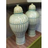FLOOR LIDDED URNS, a pair, of substantial proportions in a turquoise patterned design, 105cm H.
