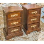 PEDESTAL CHESTS, a pair, hardwood, each of three drawers with silvered metal handles,