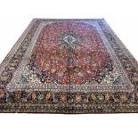 FINE KASHAN CARPET, 417cm x 297cm, central medallion on a ruby,