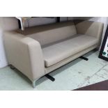 SOFA, contemporary design, having a long seat cushion in grey upholstery on chrome legs,
