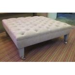 OTTOMAN EMPIRE FOOTSTOOL, square with deep buttoned grey upholstery on castors,
