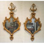 WALL MIRRORS, a pair, Adam style carved pine with shaped plates and urn crests, 87cm h x 44cm.