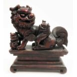 TEMPLE LIONS ON PLINTH, Asian, carved wood, approx 23cm H.