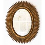 STARBURST WALL MIRROR, oval gilt metal with foliate starburst frame, 75cm H x 60cm W.