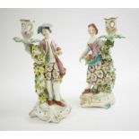 CANDLESTICK HOLDERS, a pair, Staffordshire style Denby figures, polychromed porcelain, dated 1770,