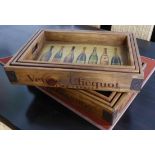 DRINKS TRAYS, a set of six, stamped with various champagne houses, 55cm W largest.